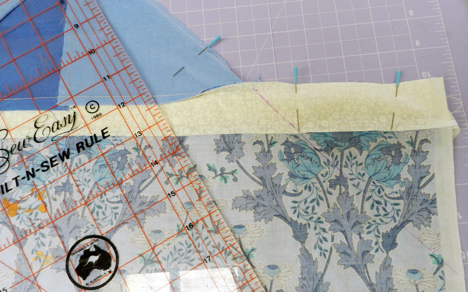 Ruler and fabric marked with pins