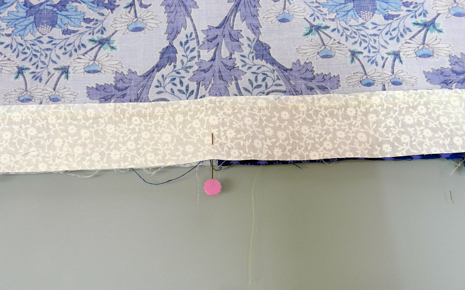 hem attached to fabric with needle