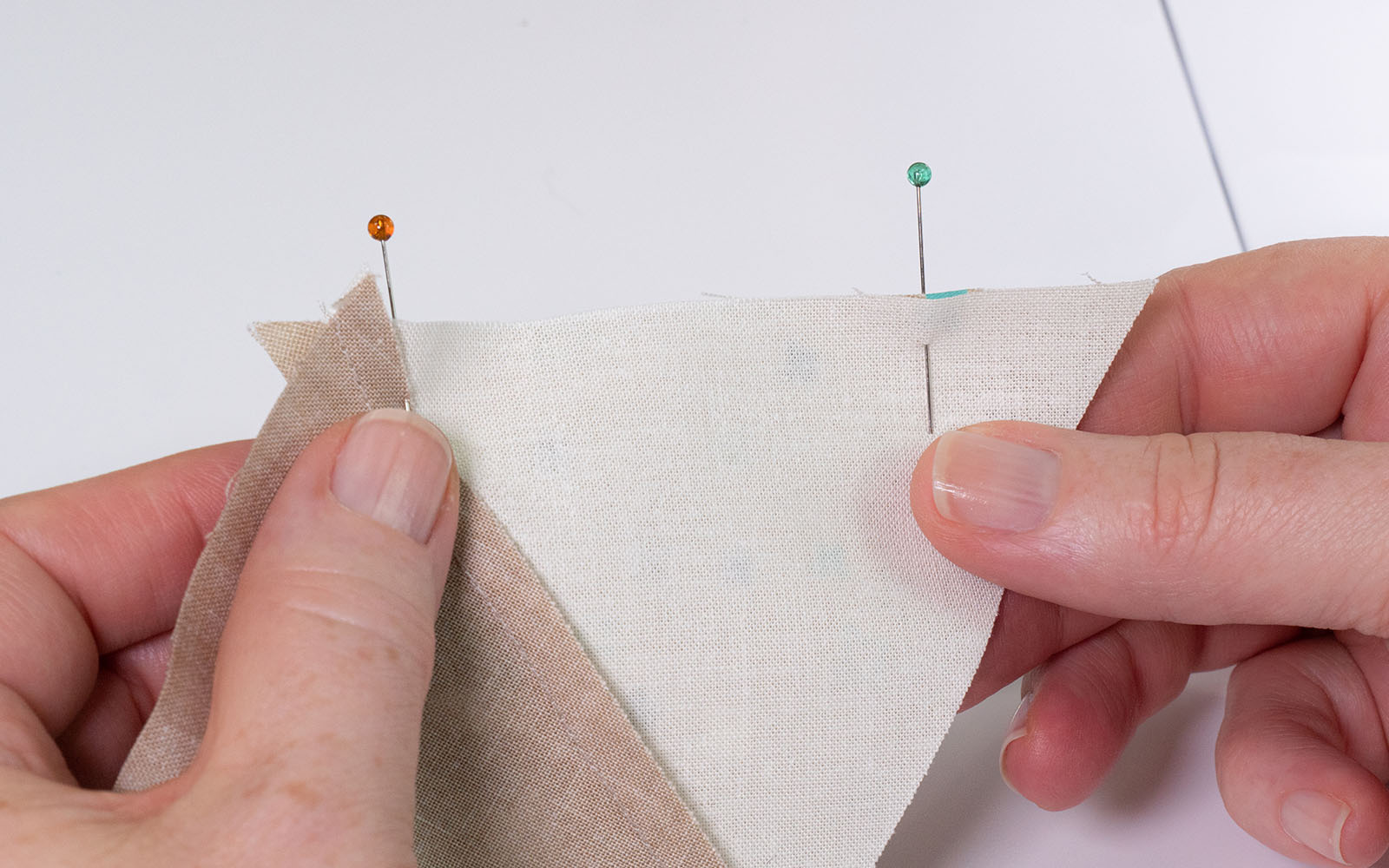 Triangles of fabric pinned