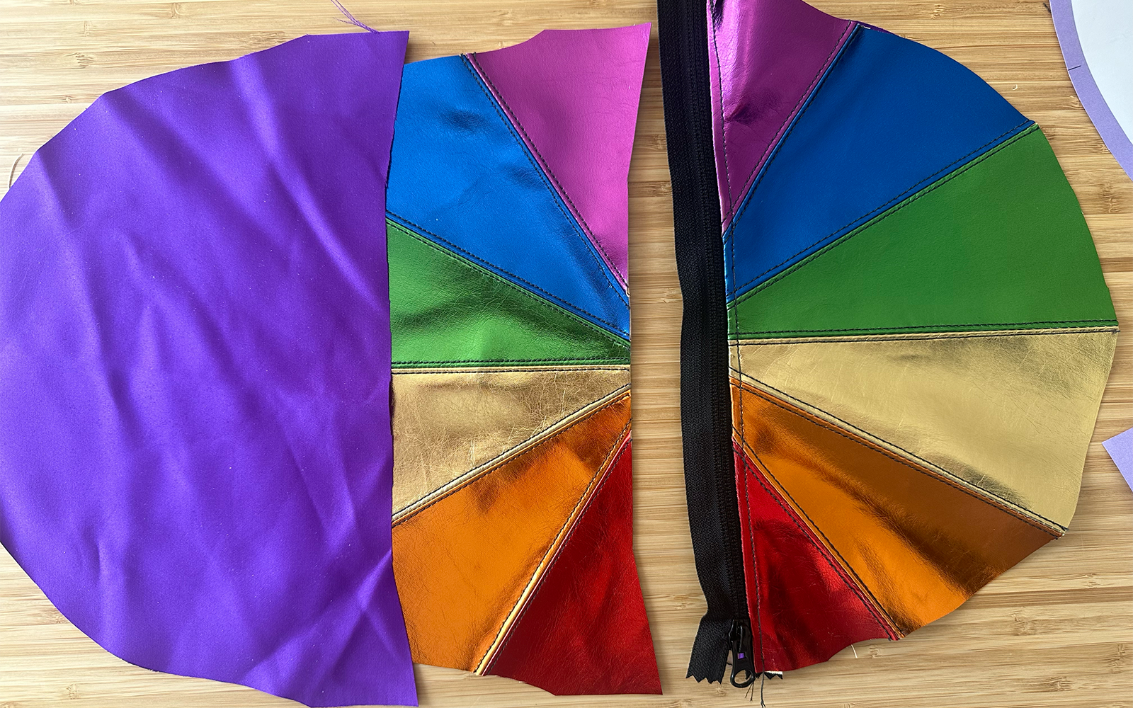 rainbow bag body and lining pieces laid out with black zipper