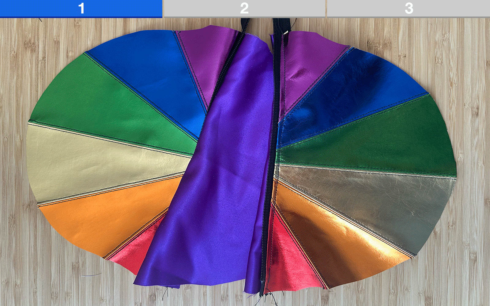 zipper being inserted in rainbow shoulder bag 