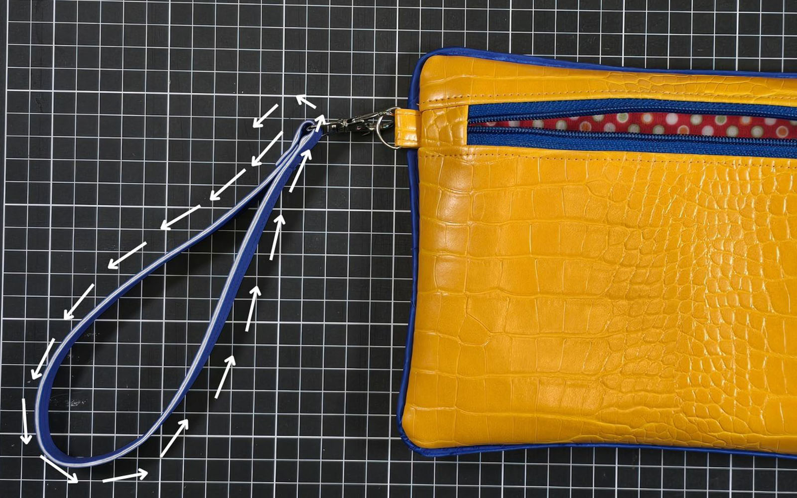 yellow crocodile pleather clutch bag with strap