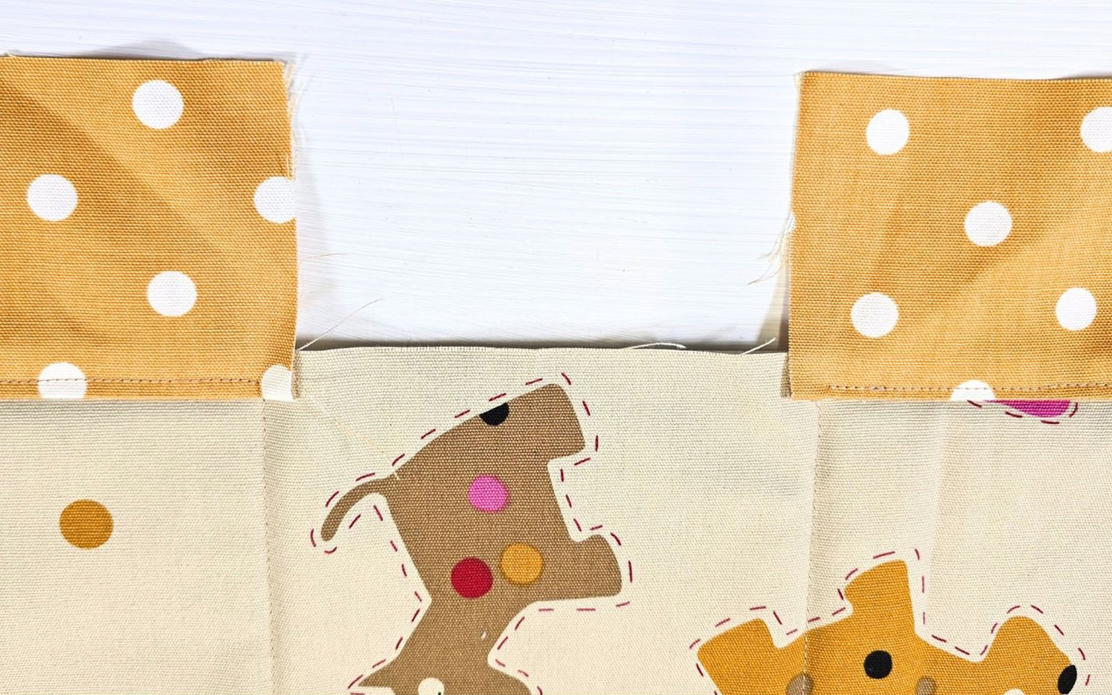 Dog fabric and yellow polka dot fabric sewn together