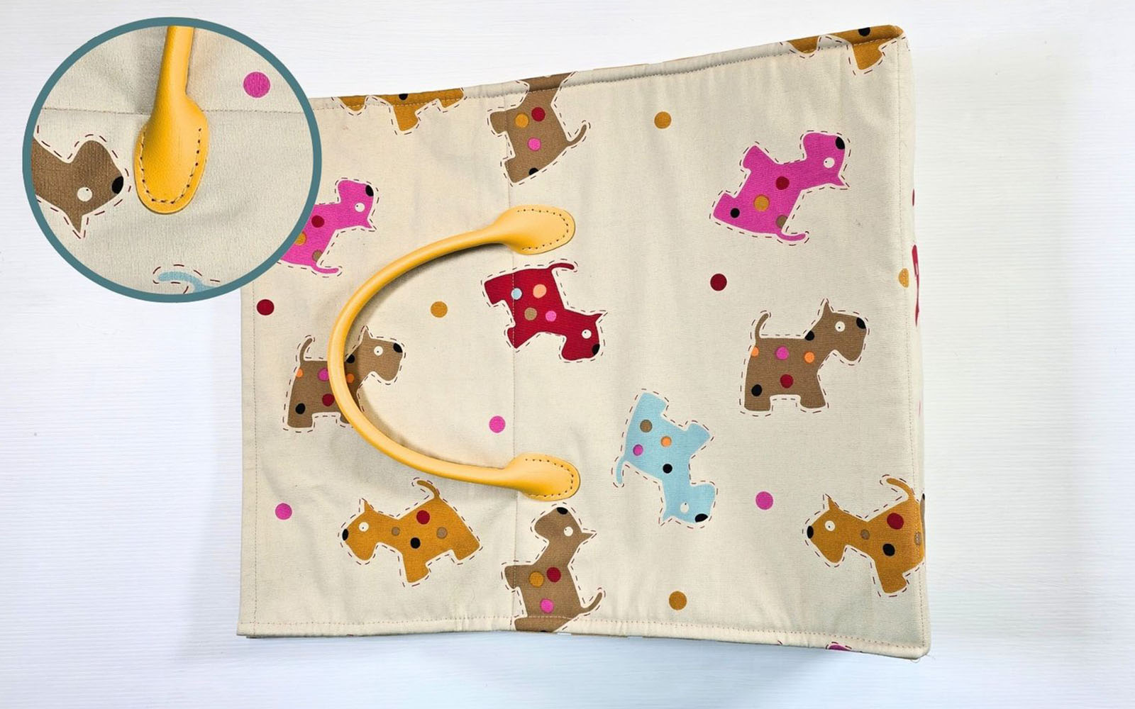 Dog patterns tote with yellow handle on side