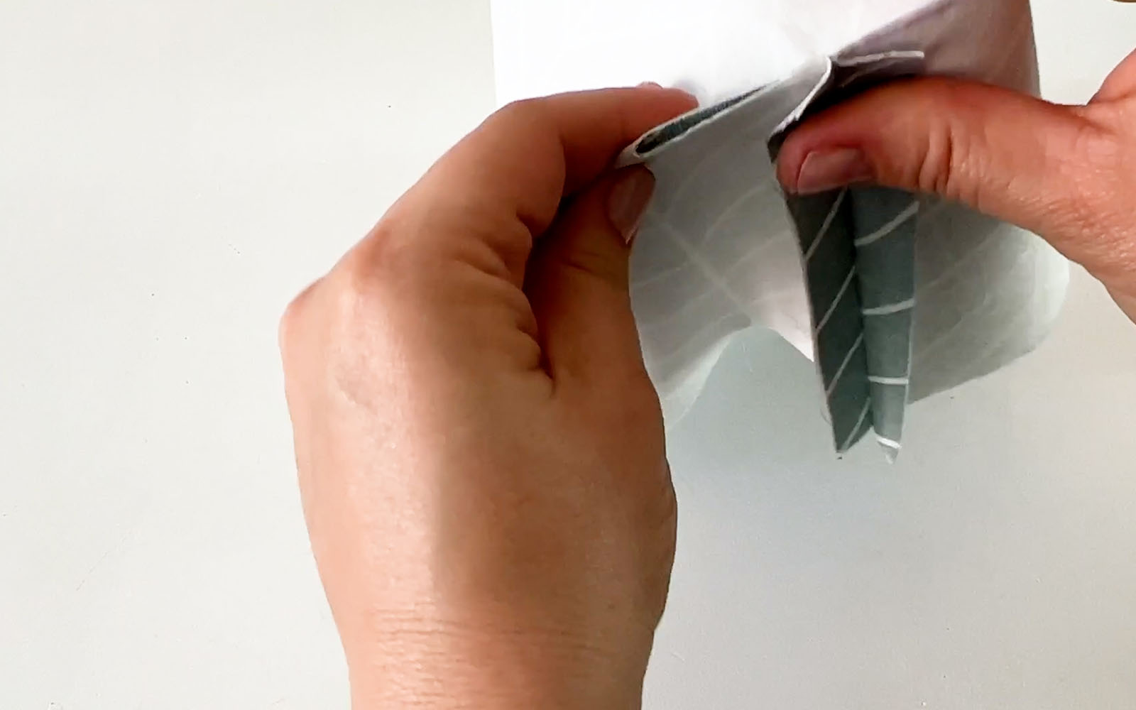 Layers of gusset on fabric pressed together with hands