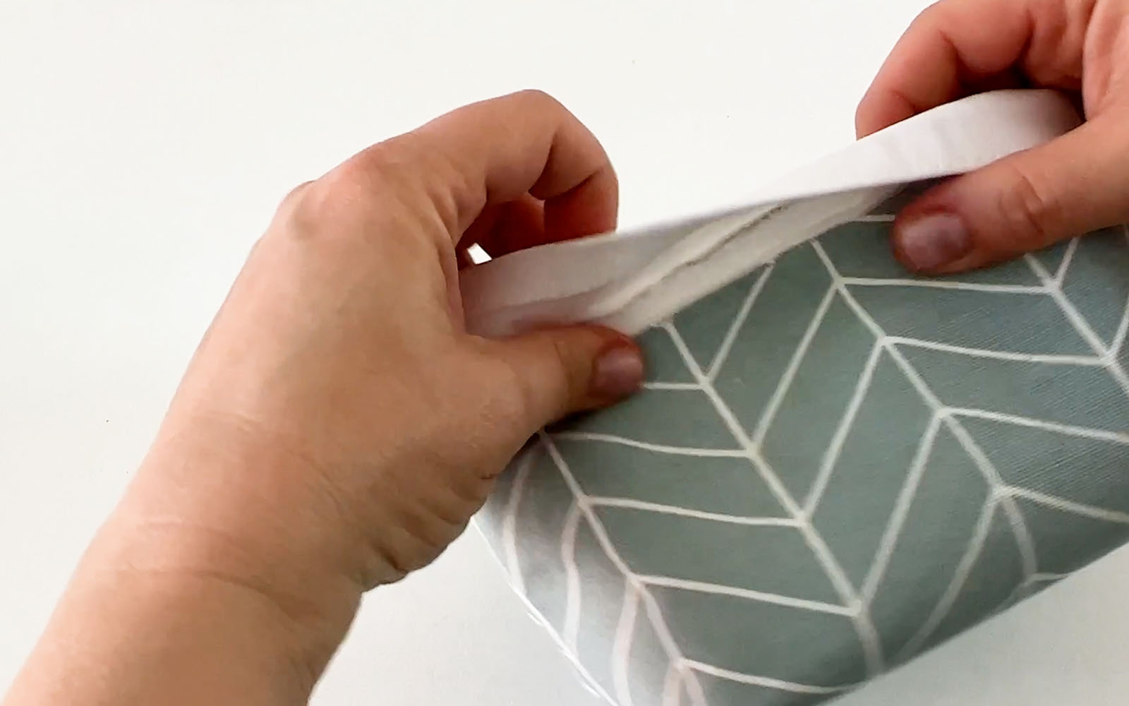 Lining being folded to outside over edges of fabric basket
