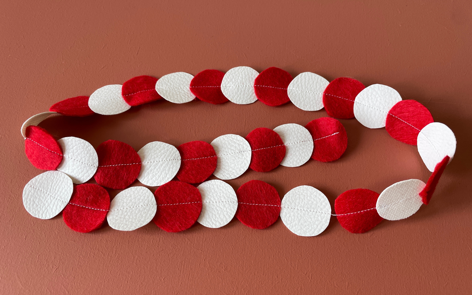 Garland made from red and white circular pieces of felt