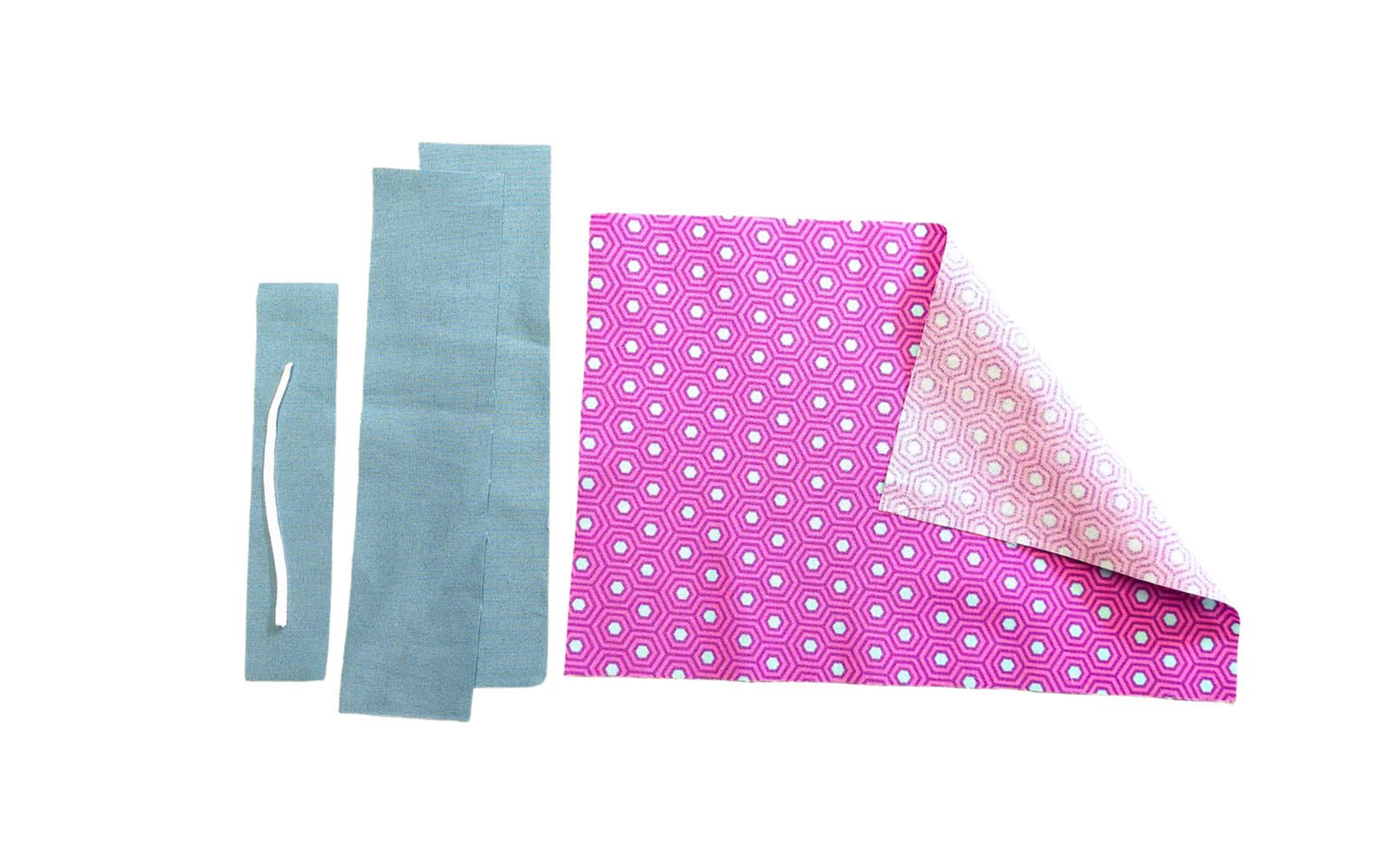 Pink and teal fabric on white background