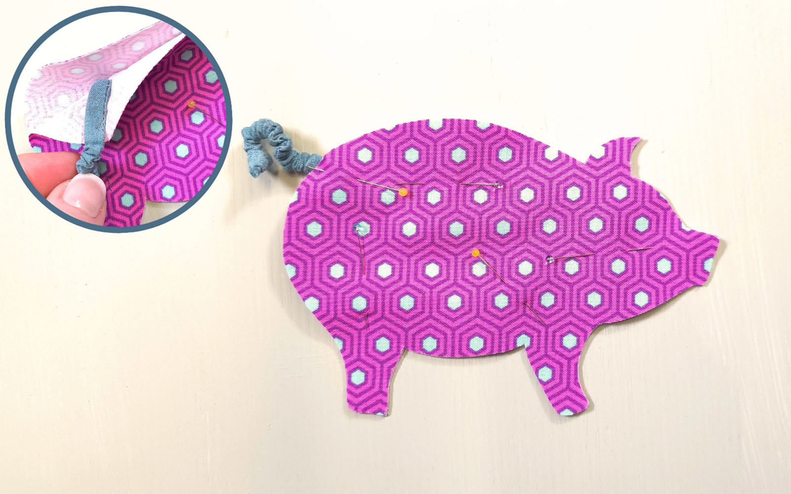 Pink fabric pig cut out on white background