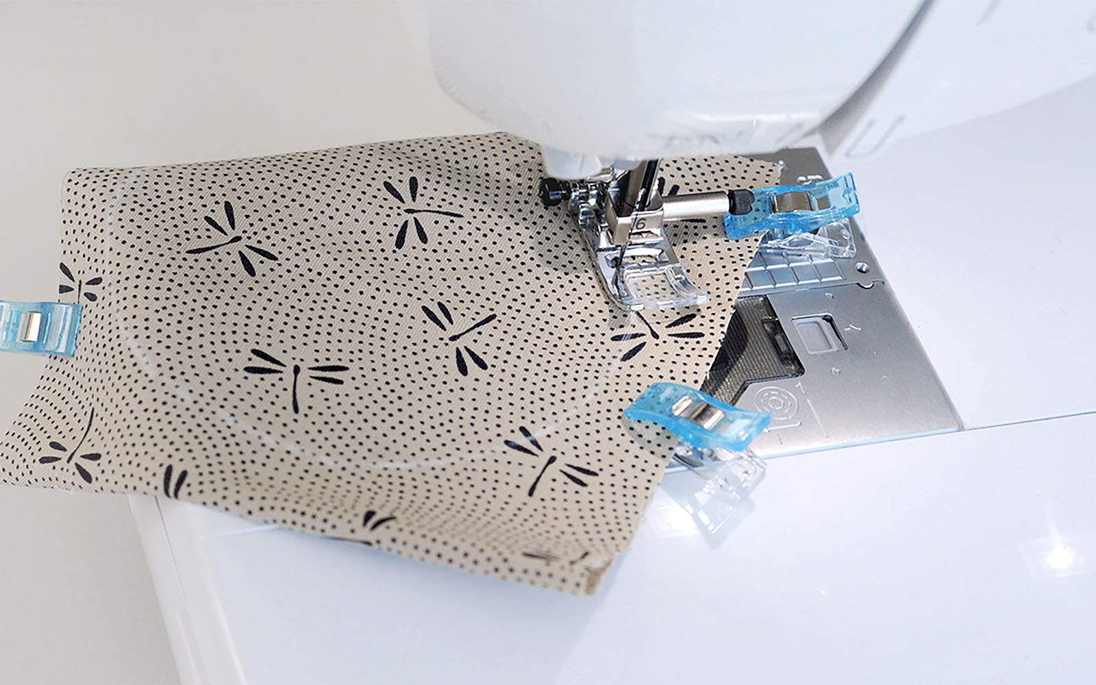 Brother sewing machine sewing beige fabric circle