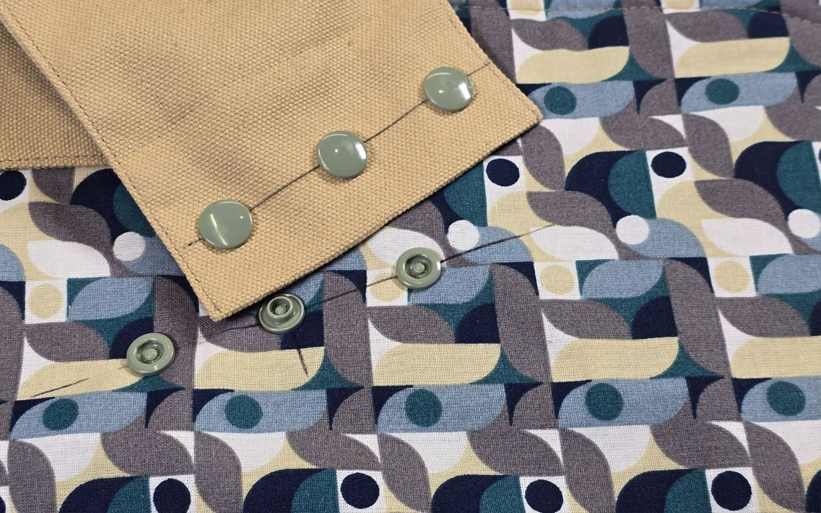 Press buttons inserted on ruched make-up bag