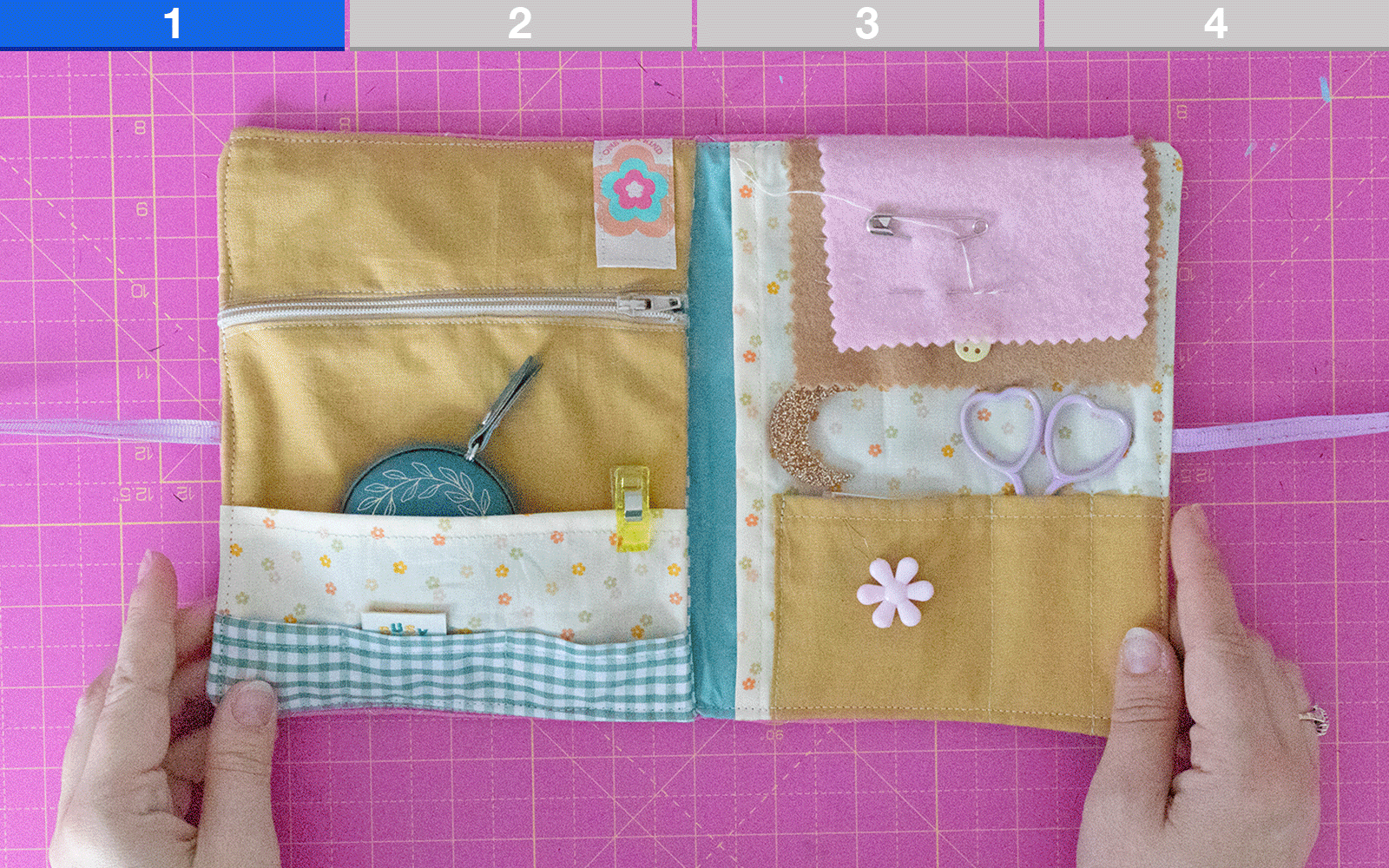 Paige Joanna holding needle storage book sewn on Brother F560