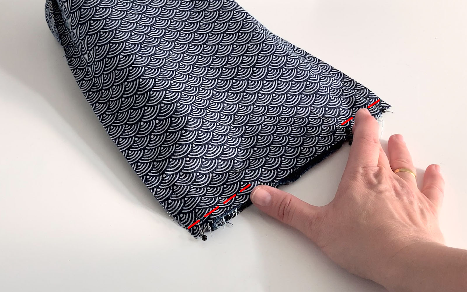 Small square bag inside out with red sewing line marked on top