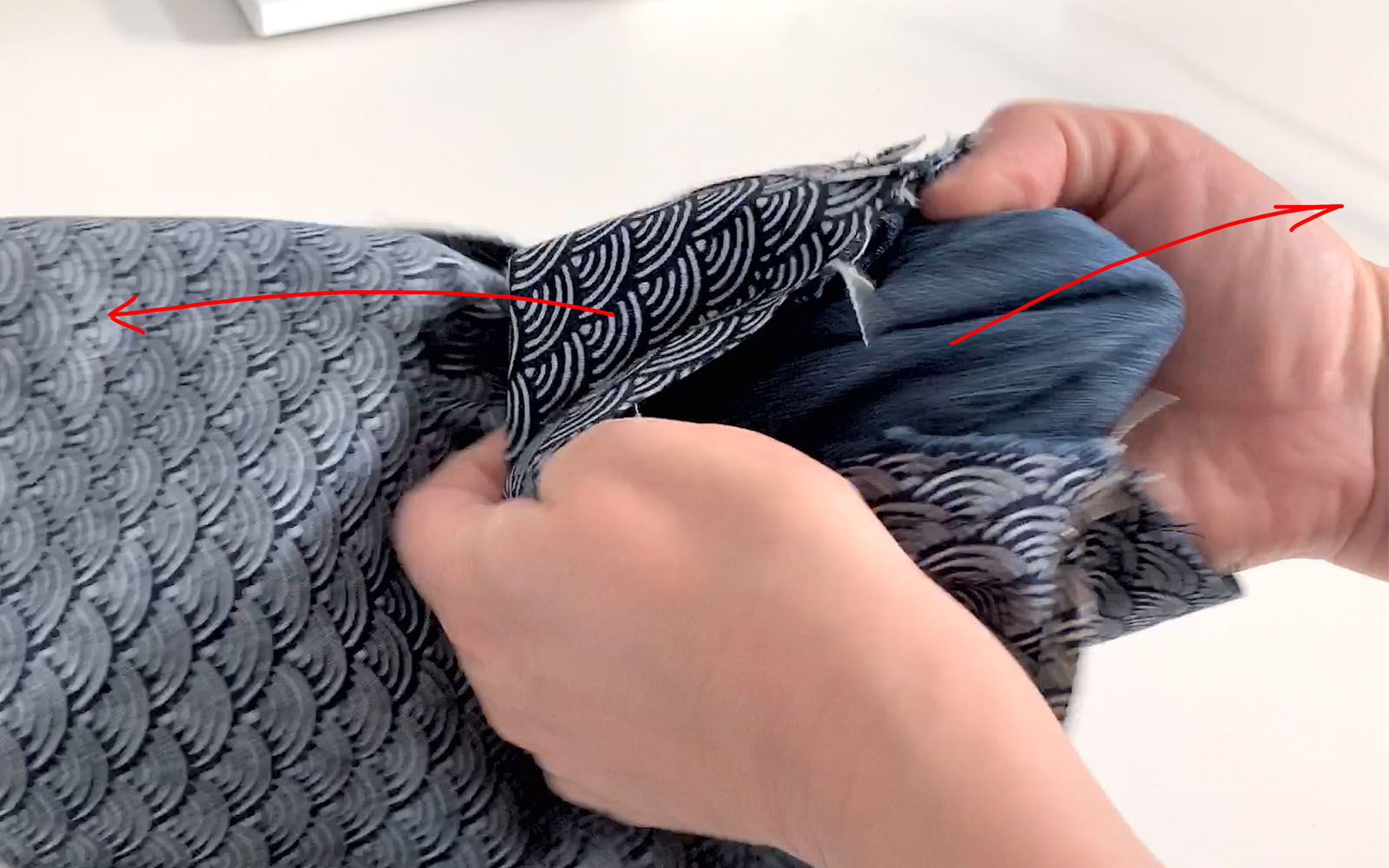 Hands pulling denim bag and lining right way round after sewing