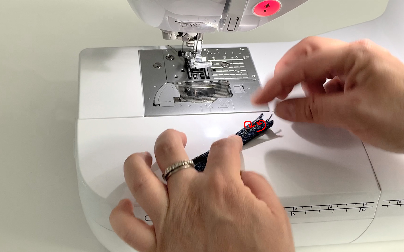 Small piece of denim on Brother sewing machine needle plate