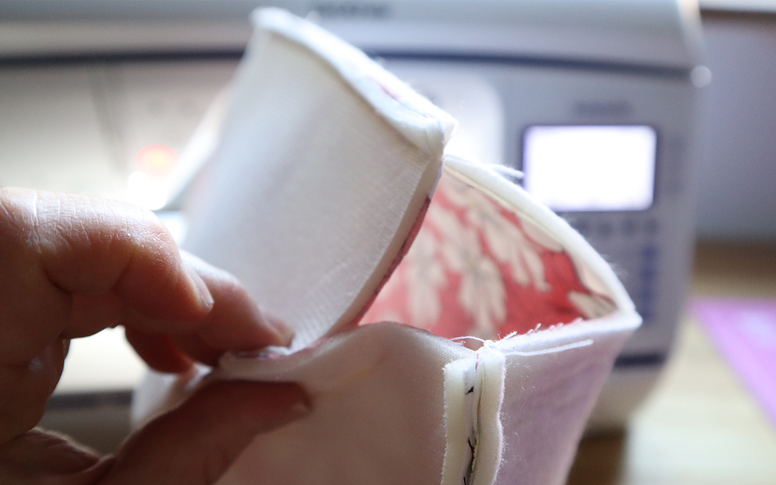 Matching fabric pieces with Brother sewing machine in background