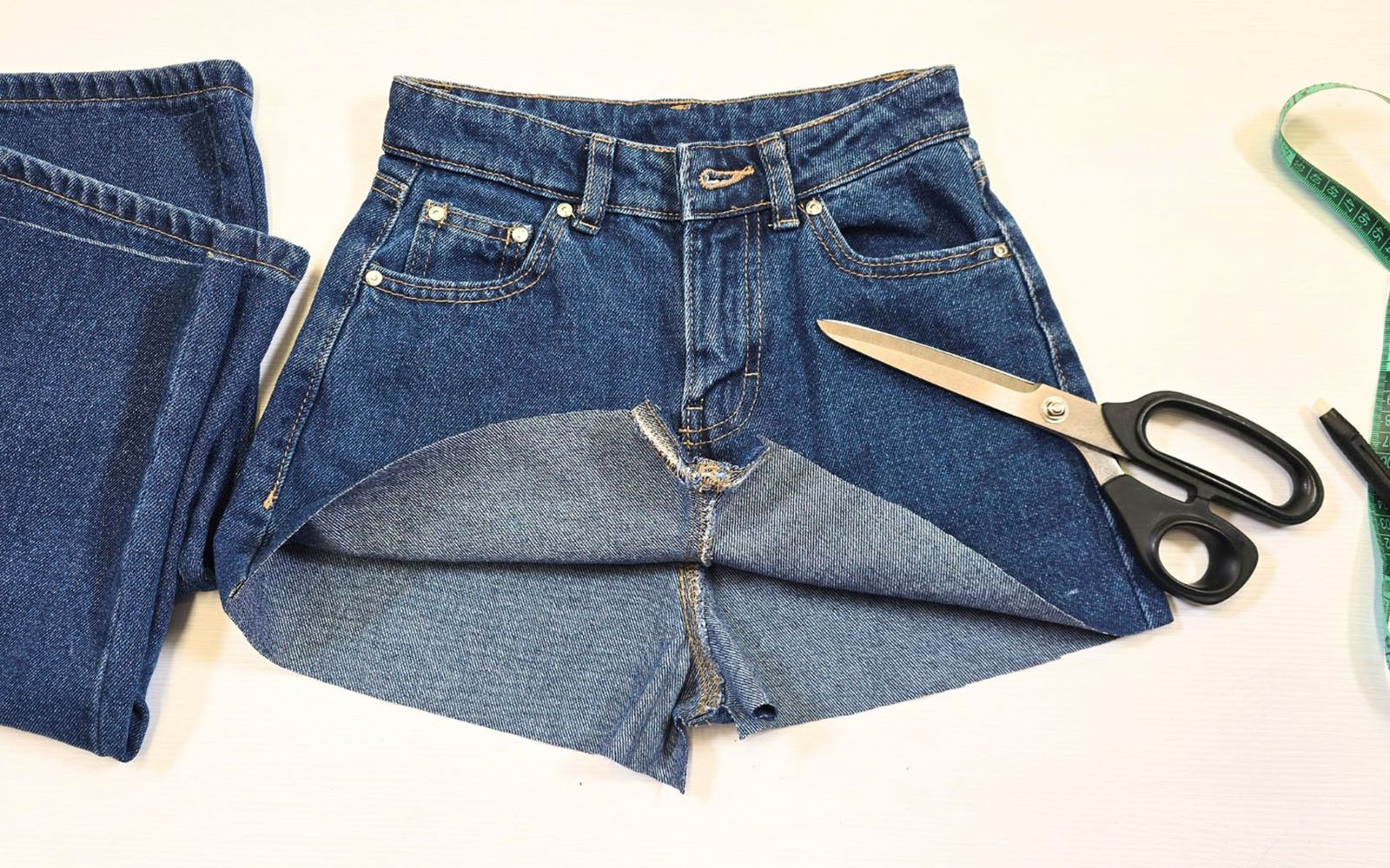 Blue jeans cut off and open at crotch with scissors