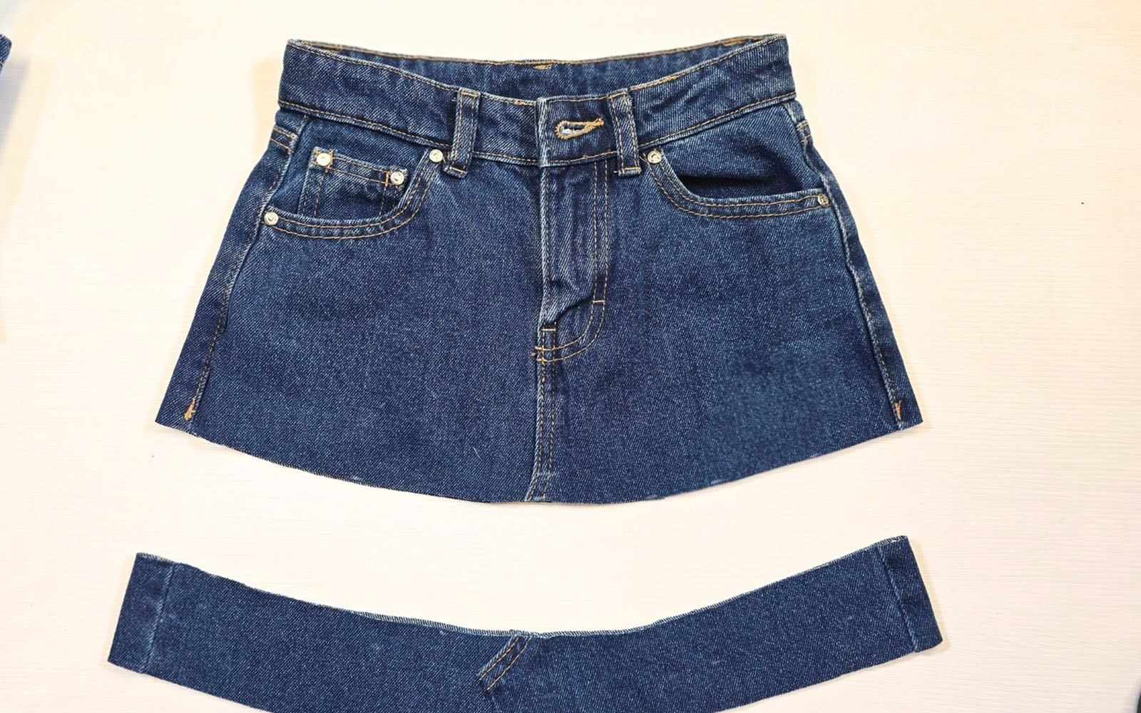 Blue denim jeans trimmed on white background