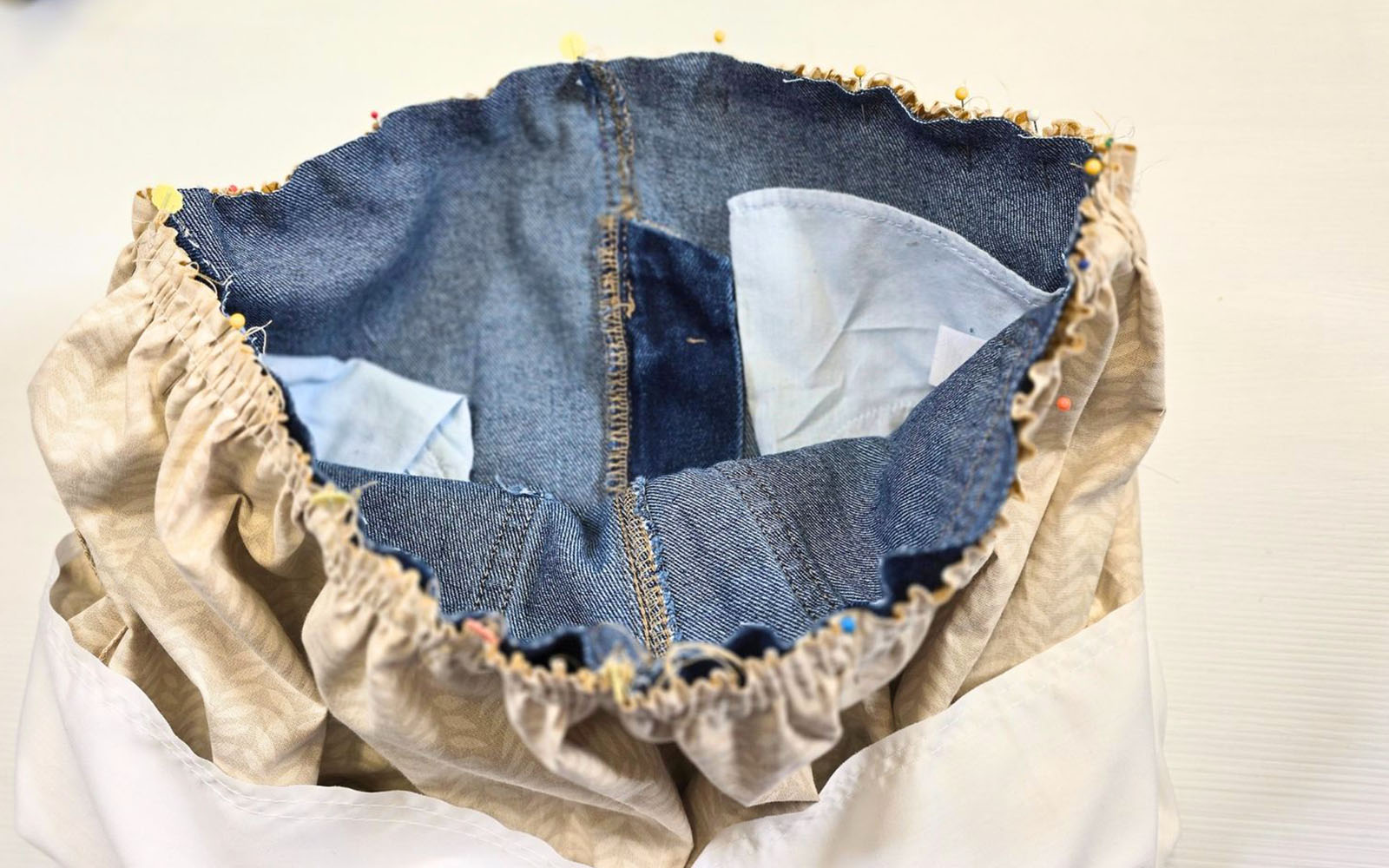 Denim and yellow cotton fabric gathered and pinned