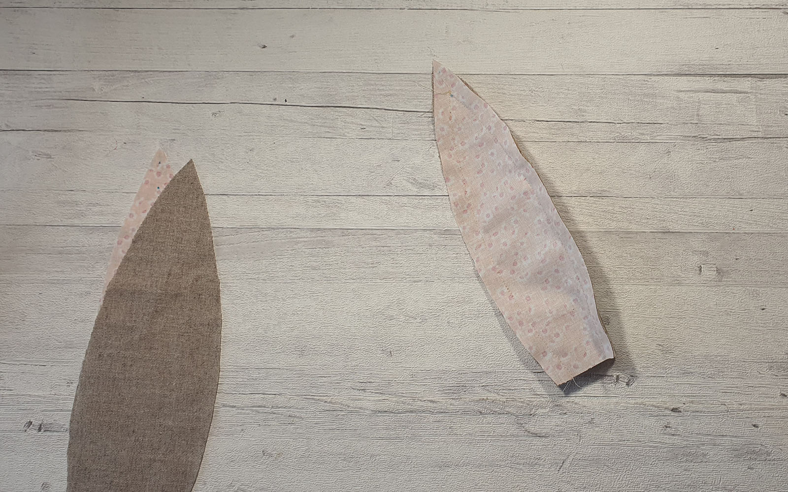fabric bunny ears on wooden background