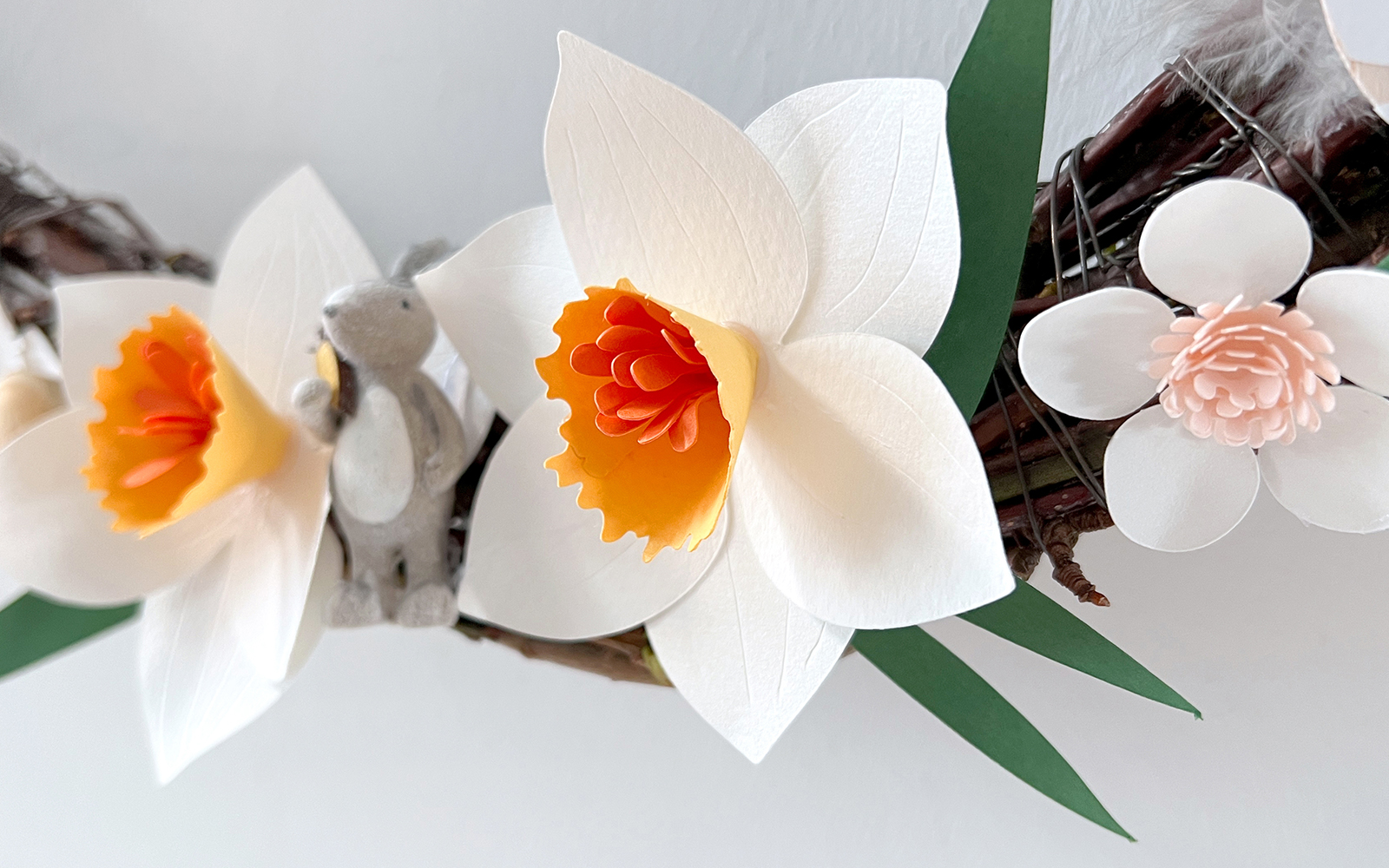 papercraft daffodils and cherry blossoms on wooden wreath