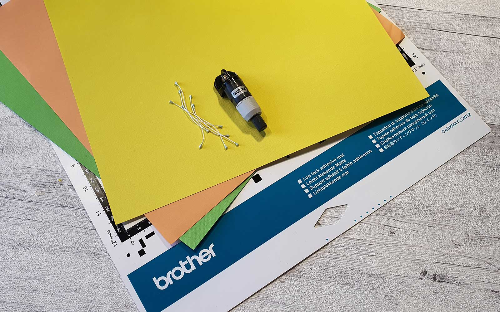 Green, yellow, orange cardstock on ScanNCut cutting mat