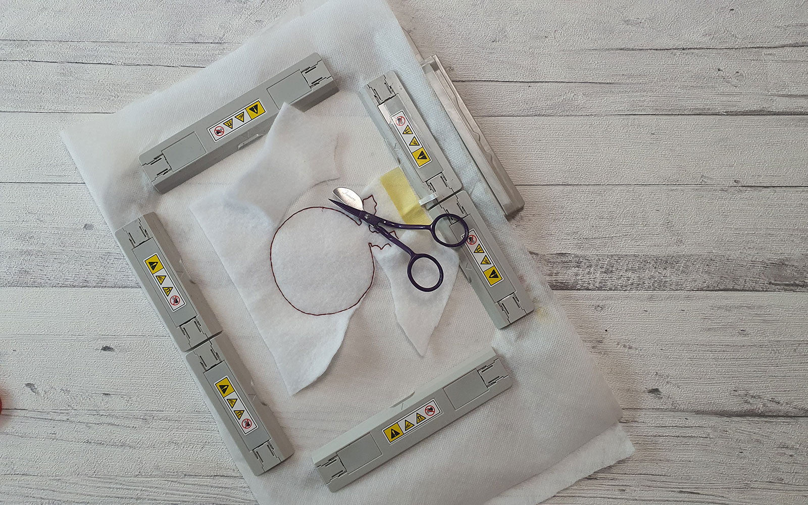 Scissors and half cut batting around sewn shape