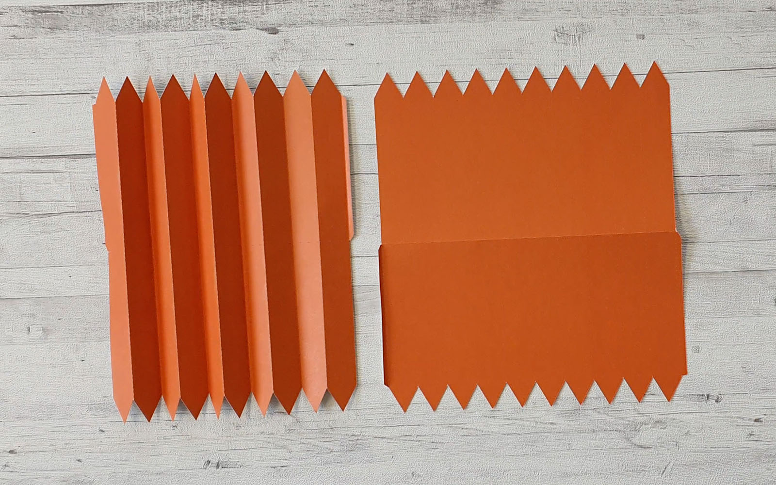 Orange cardboard pieces on white desk