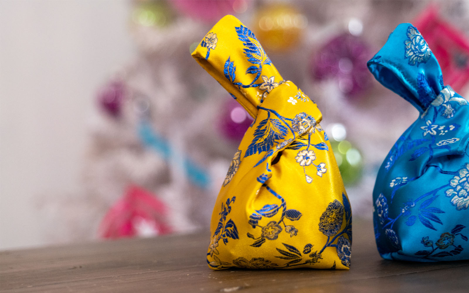 two mini knot bags on a table