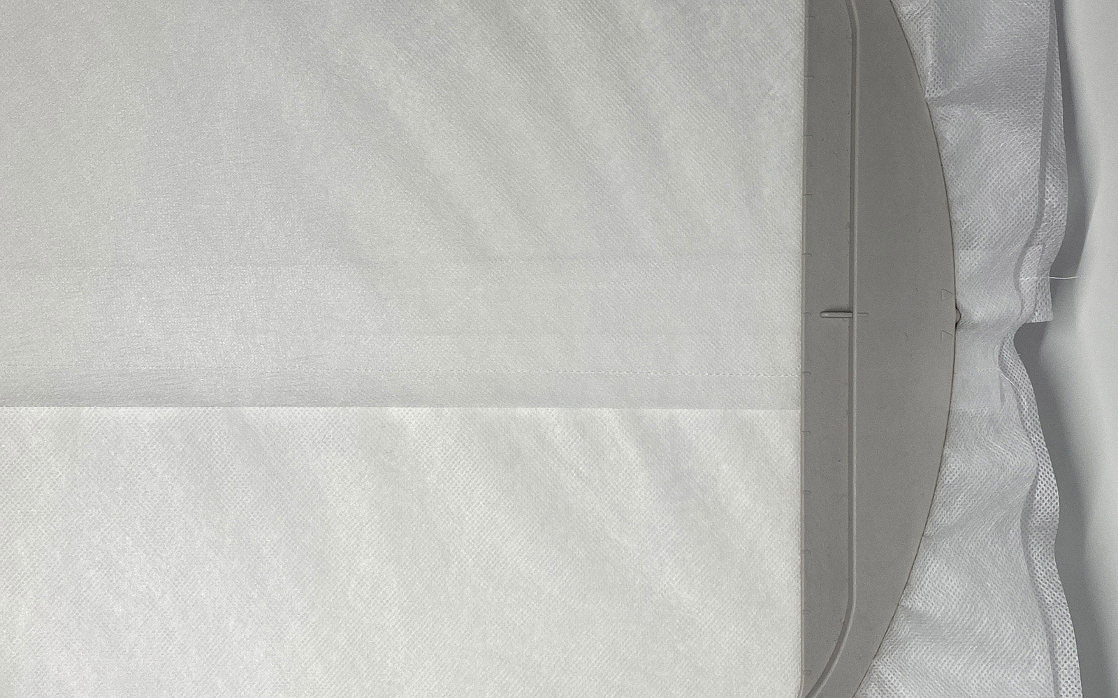 Embroidery stabiliser in embroidery hoop