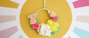 Felt flower wall decoration on painted rays