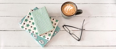 Books covered with fabric printed on Brother PrintModa fabric printer.