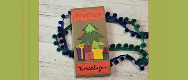 Collage Christmas card with christmas tree and presents on a desk