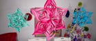 3D-Papiersterne in Grün, Rosa und Blau