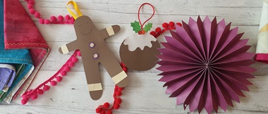 Brown paper gingerbread man on white background