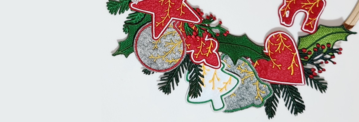Close up of embroidered Christmas wreath