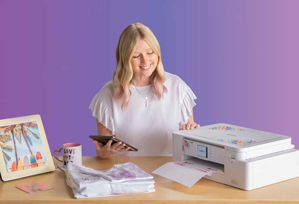 Woman behind a Brother SP1 sublimation printer