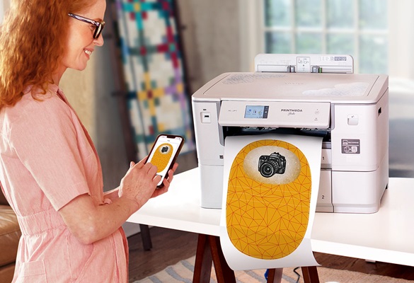 woman standing next to Brother fabric printer