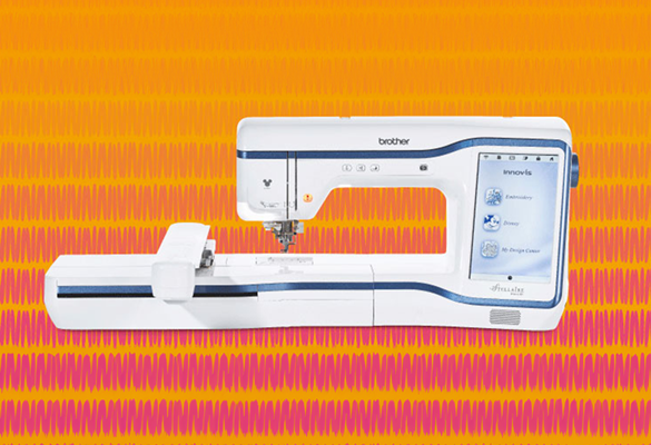 Brother Stellaire XE1 Embroidery machine on yellow and pink background