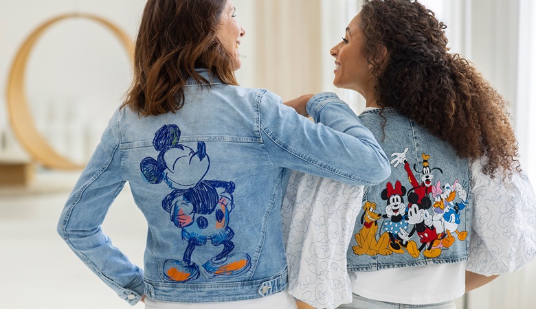 Women wearing Disney clothes embroidered and sewn with the EV1