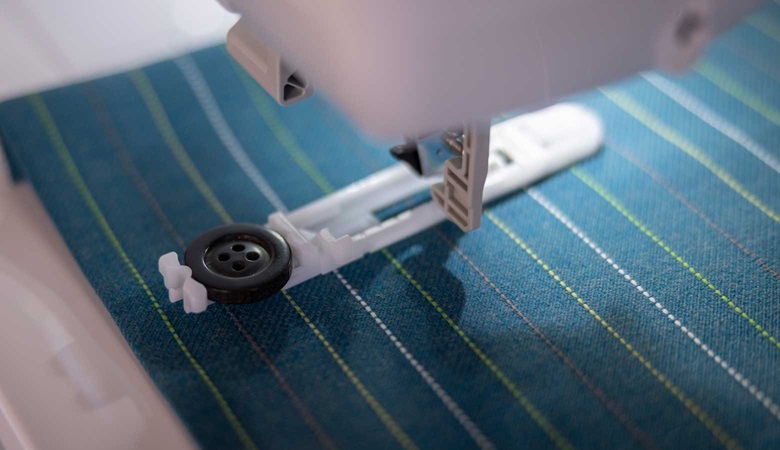 Close-up of the one-step buttonhole with a black button.