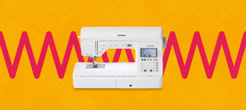 sewing machine on an orange and red pattern background 