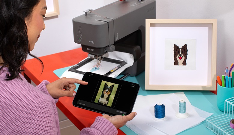 dog on tablet screen and embroidery picture