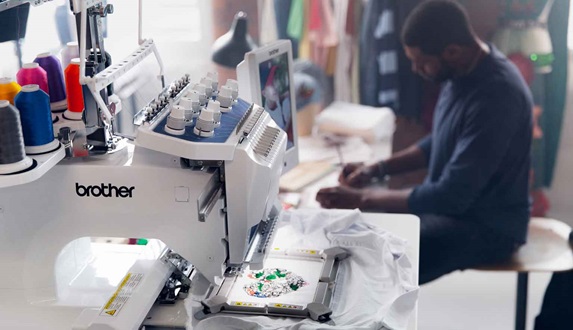 Brother embroidery machine with man in background