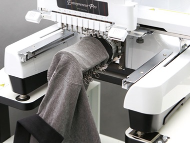 Polo shirt on cylinder frame in embroidery machine
