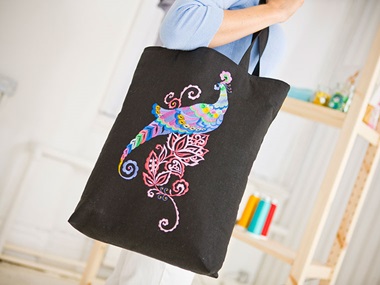Peacock embroidery on denim bag