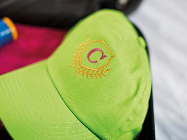 Lime green cap with letter C embroidered on