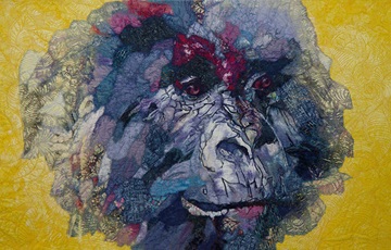Pictorial quilt design of a gorilla’s face on yellow