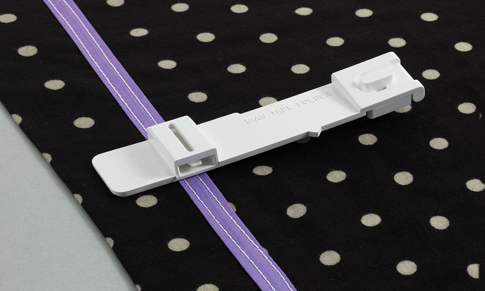 Bias tape coverstitch folder on polkadot fabric and sewn on tape