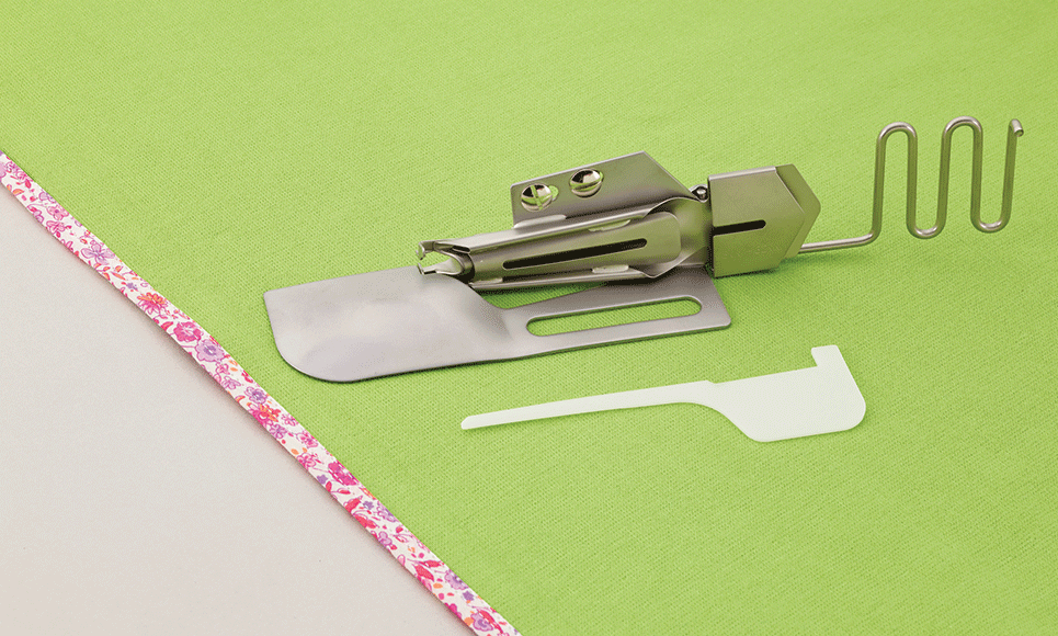 Coverstitch dual function fold binder on mint fabric with edge binding